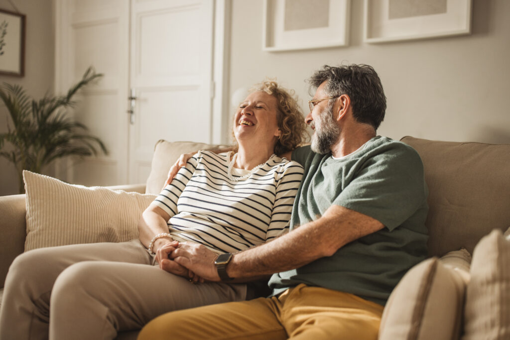 Mature couple at home, spending relaxed day together.
